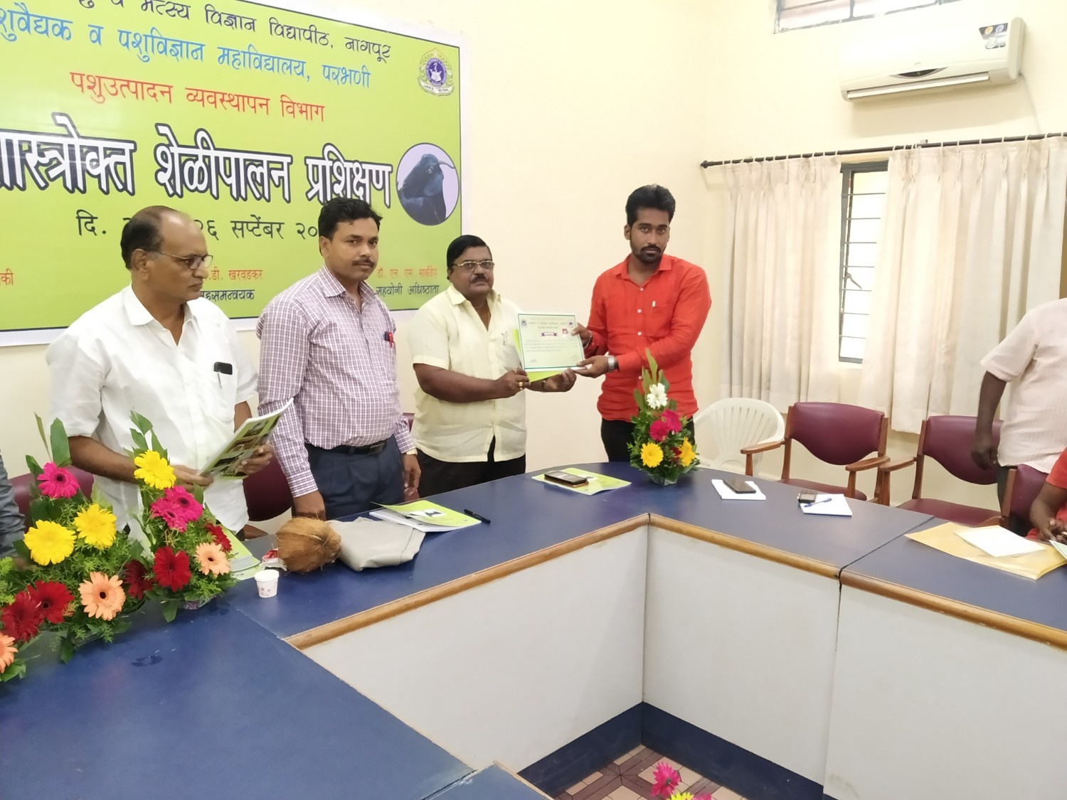 Dr. N.M. Markandey Associate Dean Distributing Certificate To Participant
